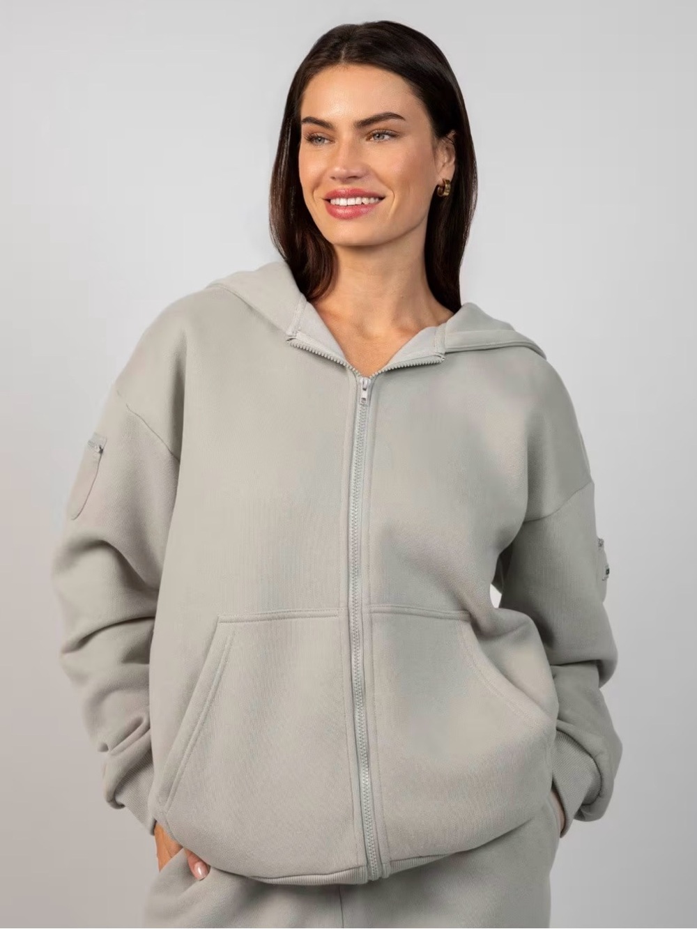 Comfrt Zip Travel Essentials Hoodie Unisex Color is stone.
